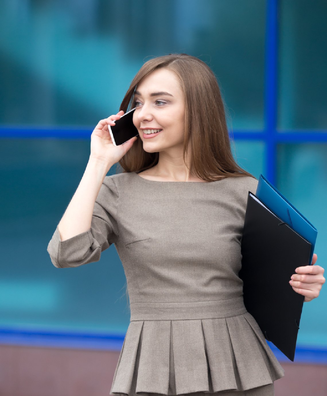 portrait-beautiful-woman-making-business-call-street