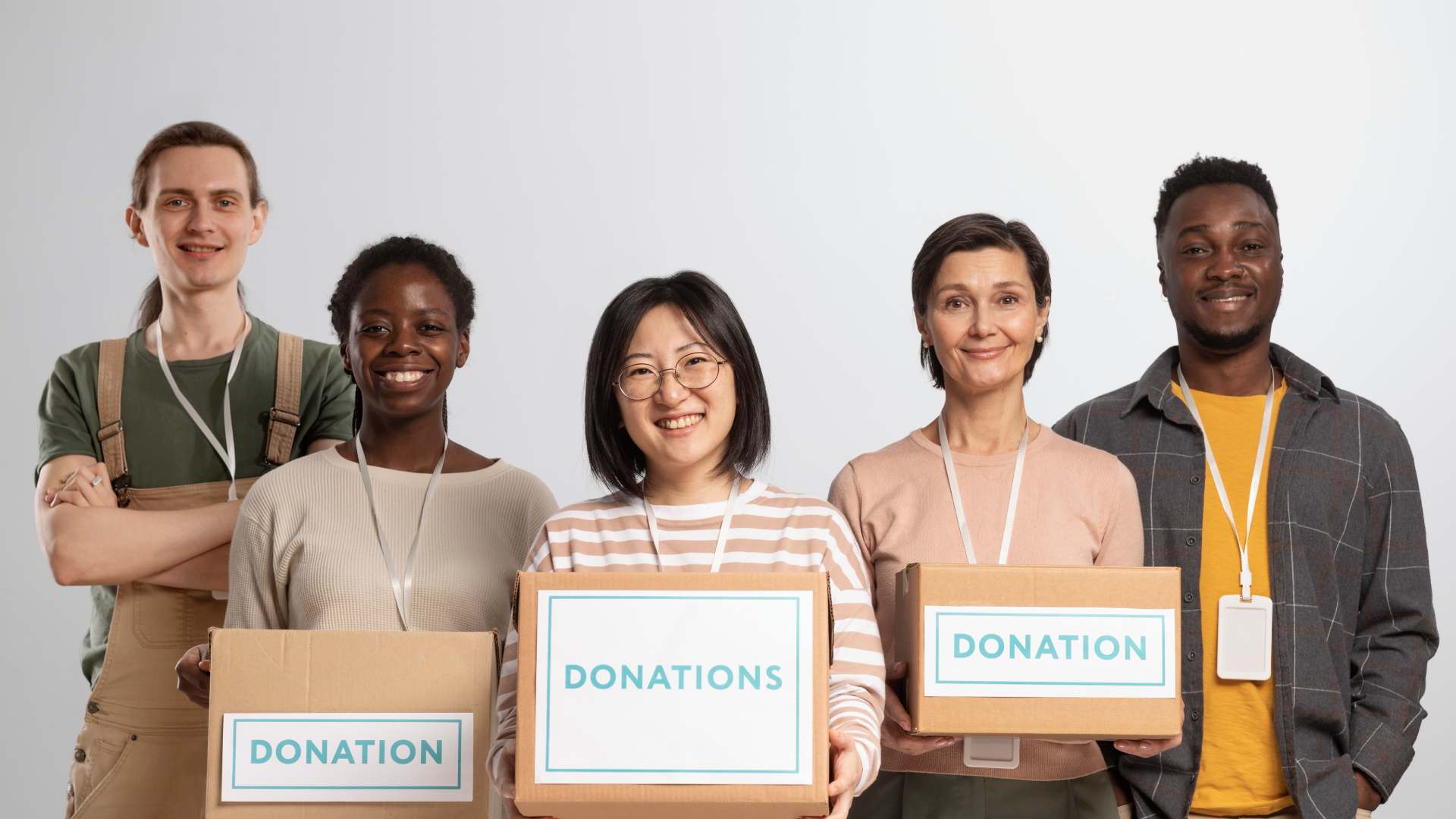volunteers-holding-boxes-containing-donations-charity