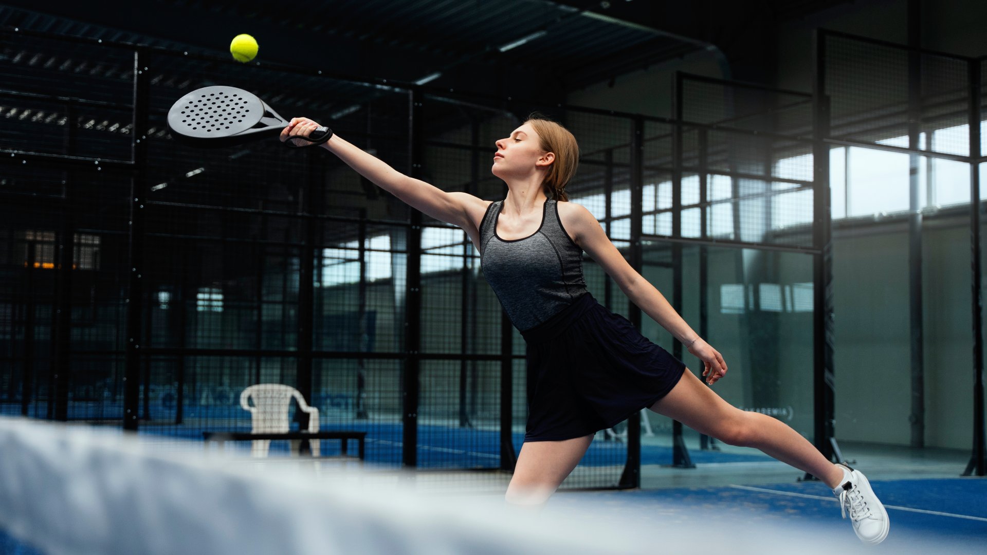 full-shot-woman-playing-paddle-tennis