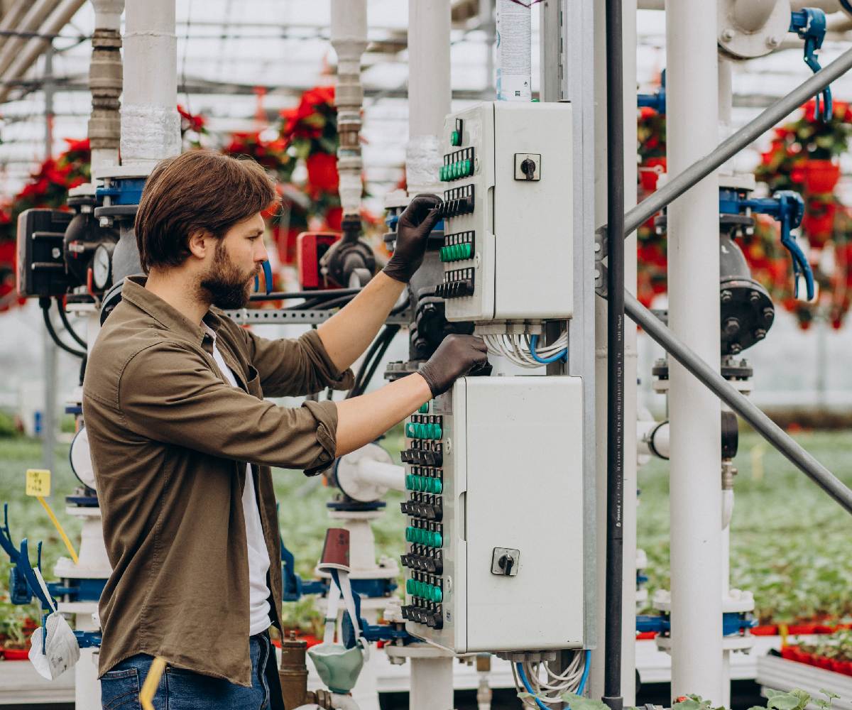 man-florist-working-green-house